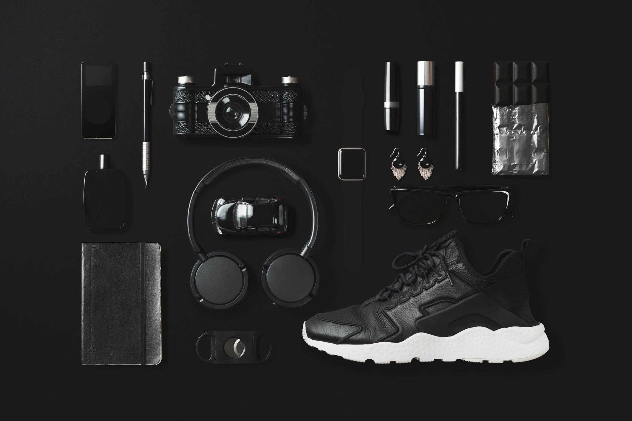 Branded products and business items arranged in a modern flat lay
